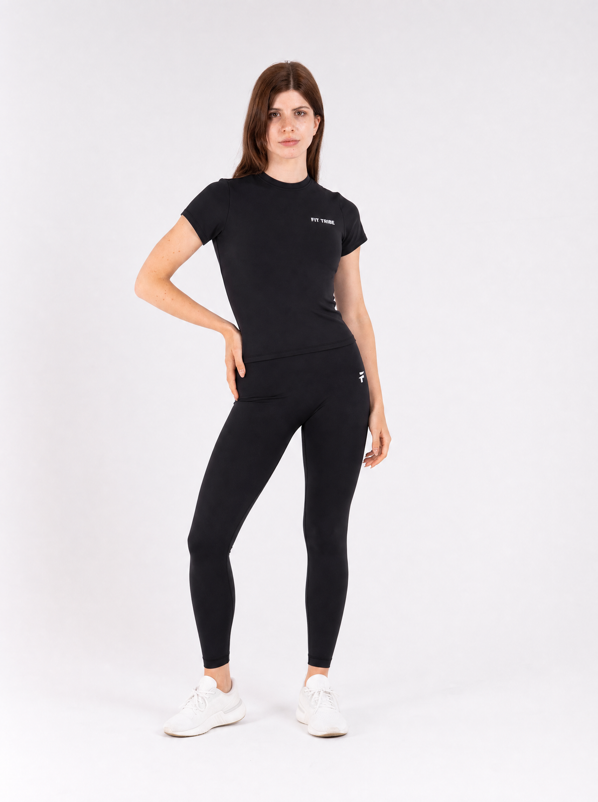 Black longline top - hand on hip editorial pose