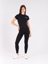 Black longline top - hand on hip editorial pose